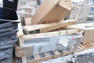 Six brand new scratch and dent items wrapped on pallets; includes sink, chair, and posts. Boxes marked Avanco, contents unspecified.