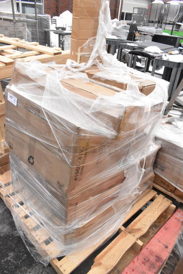 Pallet of 8 new scratch and dent items, including anti-fatigue floor mat and sink, wrapped in plastic, boxes labeled fragile.