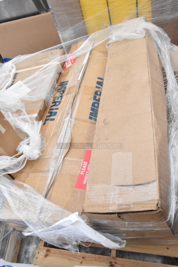 Stacked boxes labeled "Imperial," wrapped in plastic, marked with "Please Handle with Care." Contains scratch and dent items.