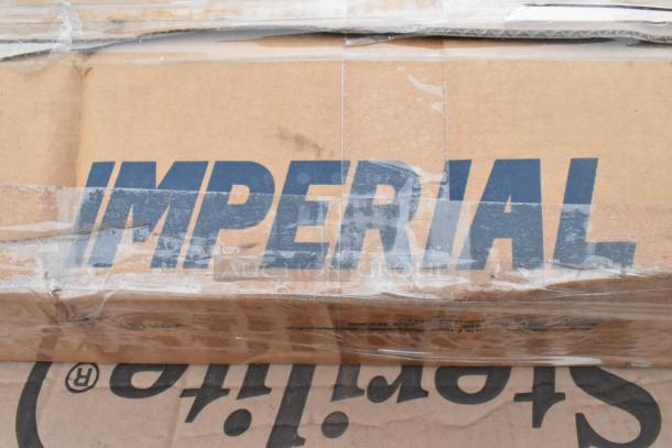 Cardboard box labeled "IMPERIAL," containing 8 brand new, scratch and dent items, including an anti-fatigue floor mat and sink.
