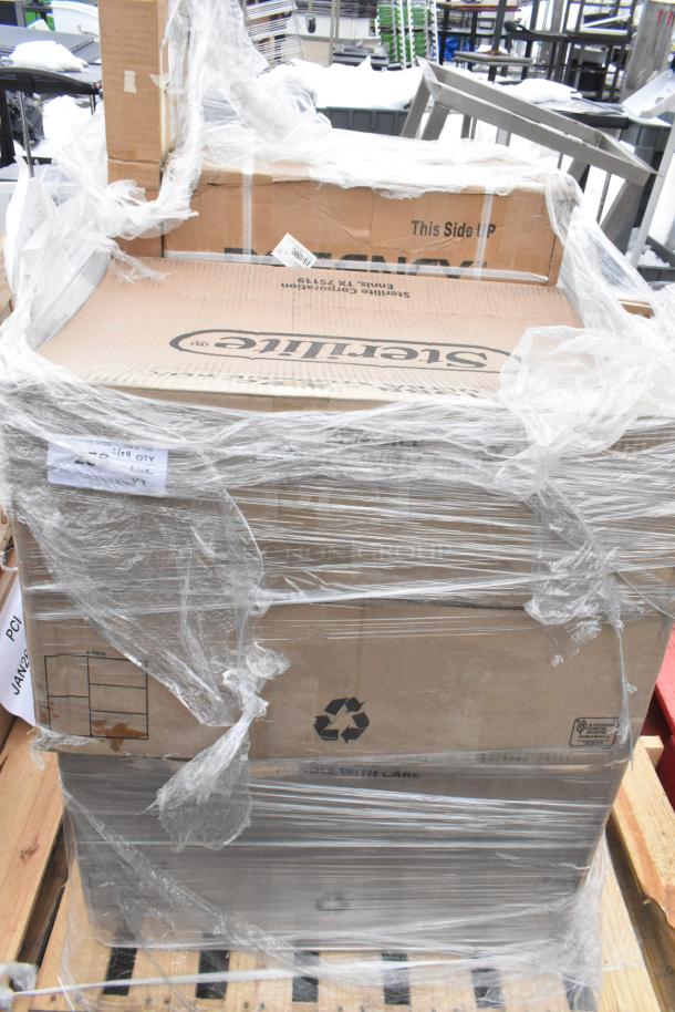 Shrink-wrapped pallet with several cardboard boxes labeled "Sterilite" and "This Side Up" containing new items, including an anti-fatigue floor mat and sink, noted as scratch and dent condition.