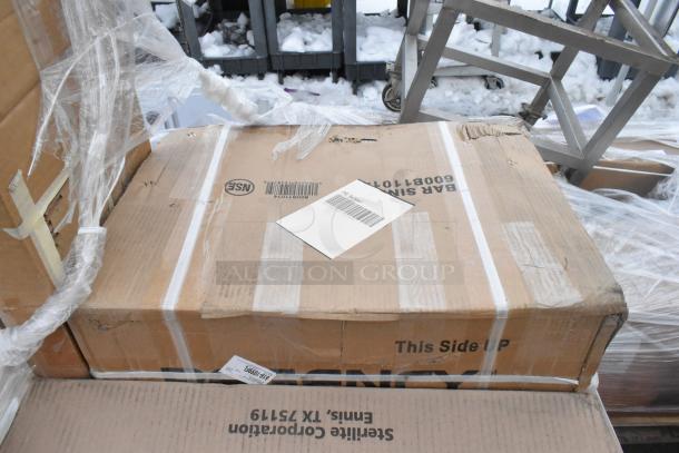 Cardboard boxes containing 8 new scratch and dent items, taped and labeled "Sterilite Corporation" and "BAR SINK."