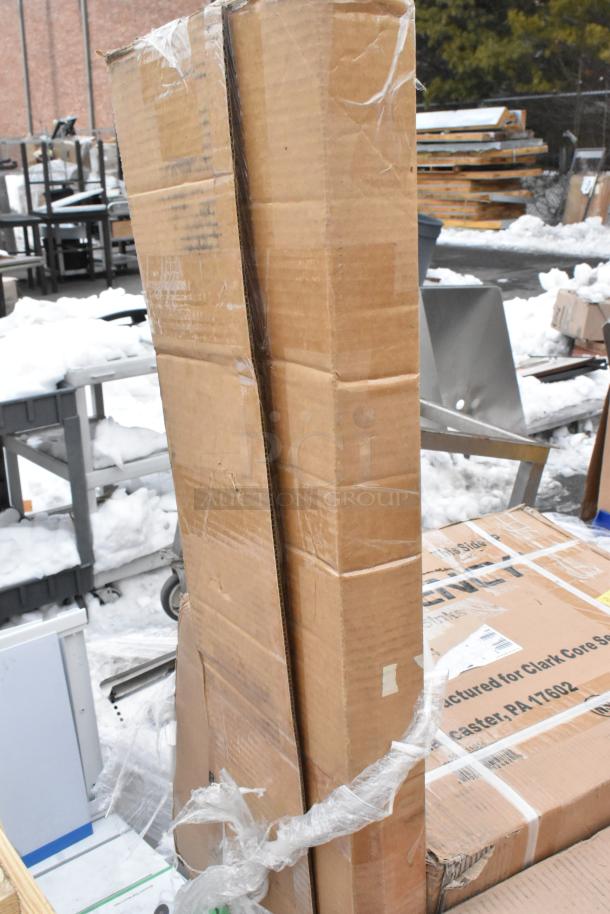 Cardboard boxes of 8 new items, including anti-fatigue mat and sink; slight scratches, visible tape and shipping labels.