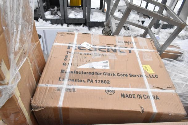 Cardboard box of Regency tables and sinks with visible dents, labeled for Clark Core Services, Lancaster, PA. Made in China.