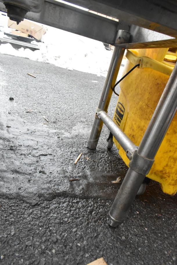 Commercial 4 bay back bar sink with dual drain boards, faucets, and handles. Stainless steel, sturdy condition.
