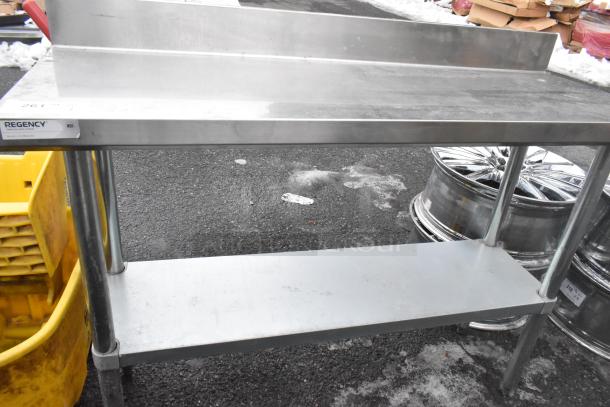 Regency 600TB1848G commercial table with under shelf, stainless steel, label indicates NSF certification, used condition.
