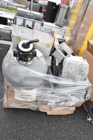 Pallet with metal baskets, light fixture, and hose, wrapped in plastic. Includes "Used Store Assets" label, various conditions.