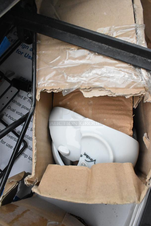 Pallet lot includes metal baskets, light fixture, and hose. Items appear in varying conditions, some boxed.