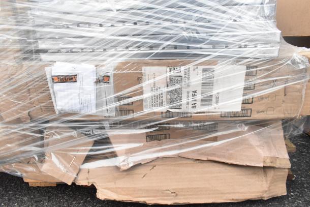 Pallet lot with metal baskets, light fixture, and hose, wrapped in plastic. Labels visible on boxes, indicating mixed contents.