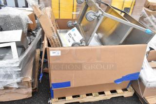 New scratch and dent items including Koala Kare Infant Seat Kradles, utility sink, and ice bin on pallet with packaging.