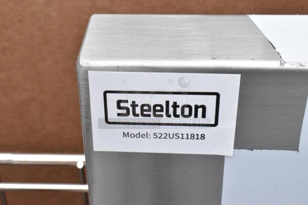 Steeltone utility sink, model 522US11818, brand new with minor scratches. Stainless steel finish, durable construction.