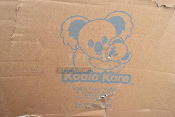 Cardboard box with Koala Kare logo, showing slight damage. Contains scratch and dent infant seat kradles.