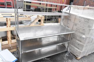Stainless steel commercial table with two-tier over shelf and two under shelves by Eagle, in excellent condition.