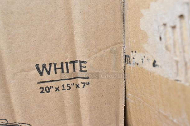 Cardboard box labeled "WHITE 20 x 15 x 7 inches," part of auction for 36 scratch and dent items including butane range and trays.