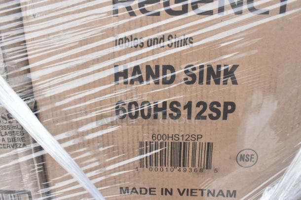 Cardboard box labeled "Regency Hand Sink 600HS12SP," NSF certified, made in Vietnam, packaged with protective wrap.