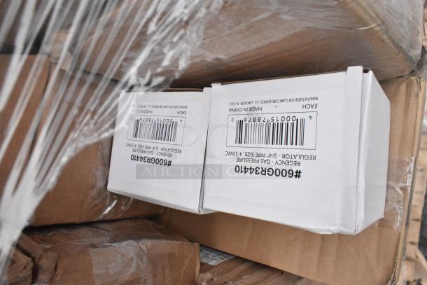 Boxes labeled "REGENCY GAS PRESSURE REGULATOR" wrapped in plastic, part of a lot of 36 new scratch and dent items.