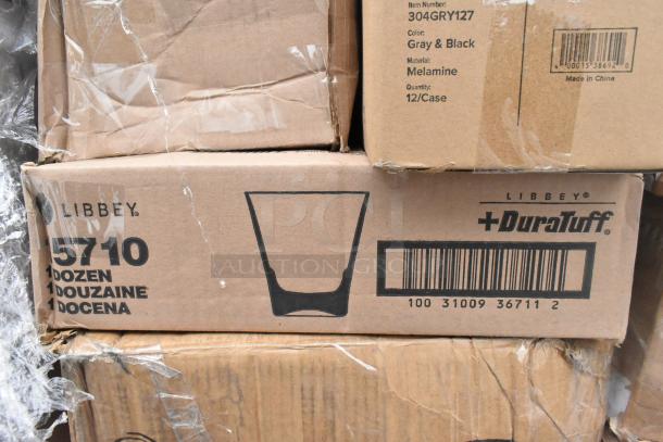 Boxes labeled Libbey DuraTuff, 1 dozen glasses per box. Includes item numbers and barcode. Scratch and dent condition.