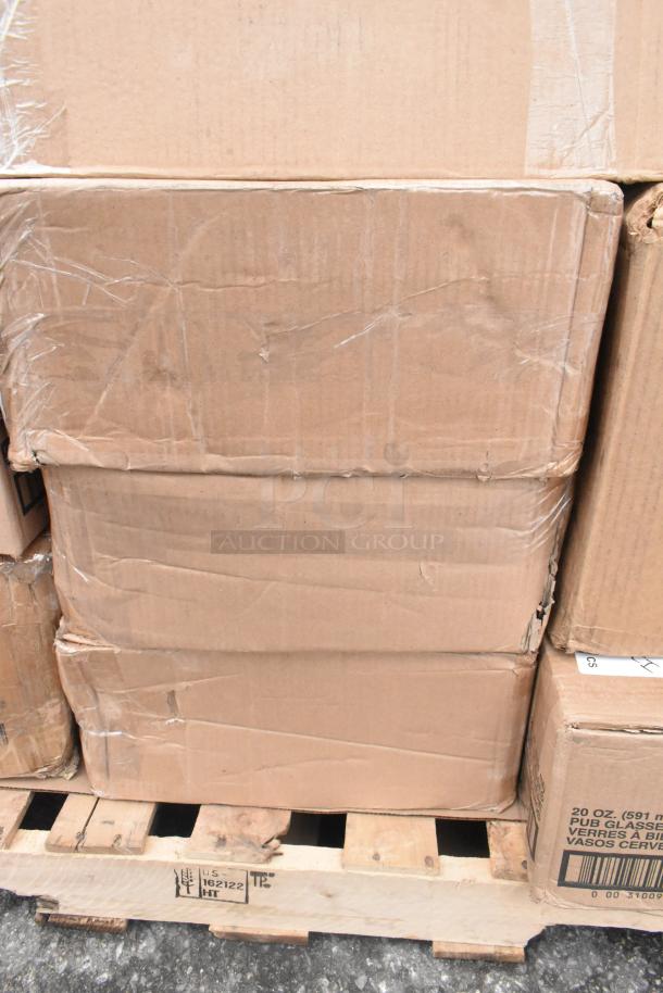 Cardboard boxes on pallet, containing 36 assorted new scratch and dent items like a butane range, casters, plates, and trays.