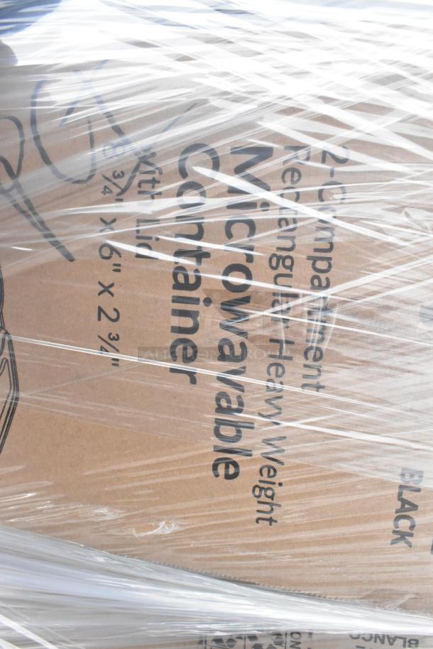 Cardboard box wrapped in plastic, labeled "2-Compartment Microwavable Container, Heavy Weight." Contains scratch and dent items.