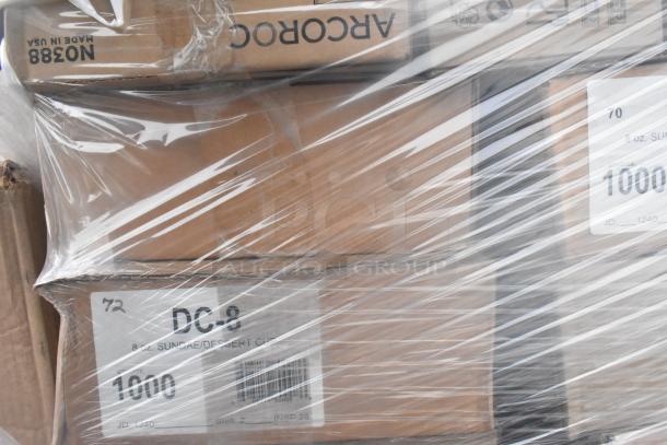 Plastic-wrapped pallet with boxed Arcoroc rocks glasses, soup carrier, dessert cups. Labels state "Made in USA", "DC-8".
