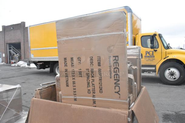 Cardboard box labeled "Regency Space Solutions" containing a new rack platter. Includes 18 scratch and dent items.