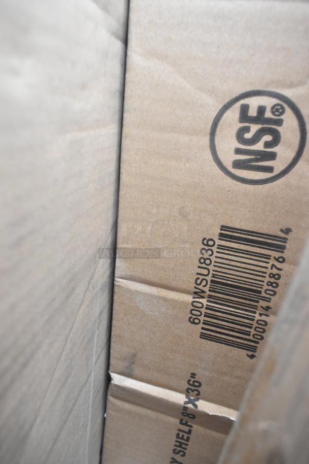 Cardboard box with "NSF" logo and barcode; labeled "600WSU836". Contains scratch and dent items, incl. shelf and tables.