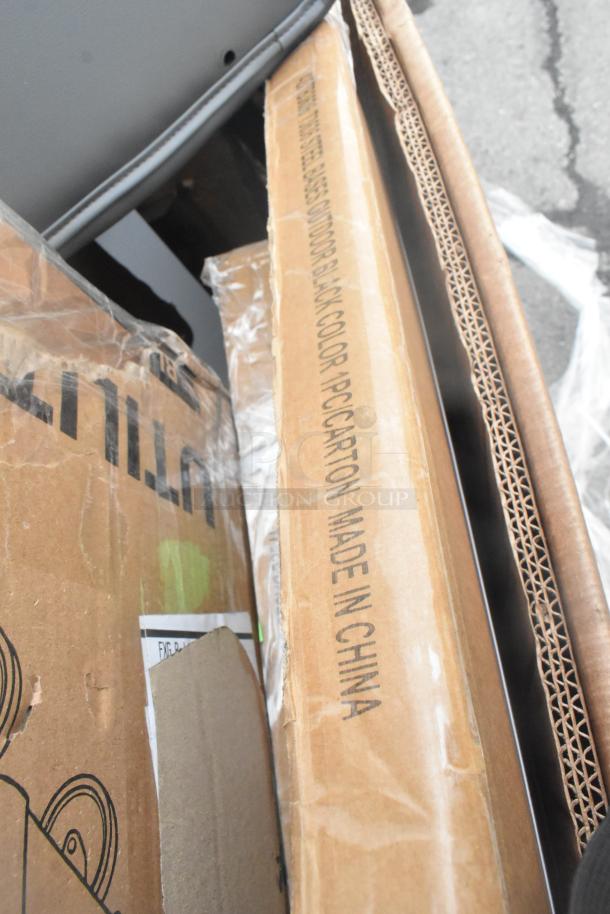 Auction items, brand new but with scratches and dents, boxes with various equipment, label indicates "Made in China."