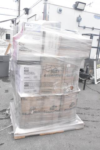 Pallet of assorted items, including Bounty paper towels, Choice plastic forks, and portion cups, wrapped in plastic, scratch and dent condition.