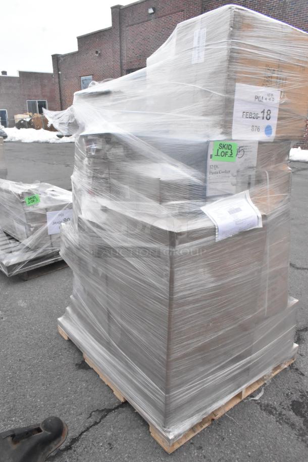 Pallet wrapped with 28 new items including roller grill sneeze guard and can opener. Visible labels: "Skid Lot 3" and "Pasta Cooker".