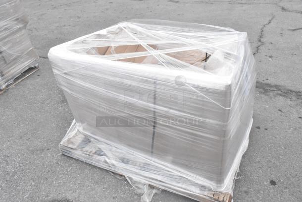 Regency 600S21824 sink, brand new with scratch and dent, wrapped in clear plastic on a pallet.