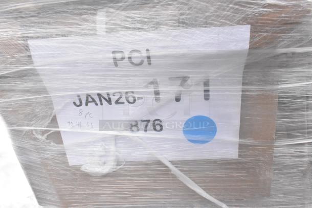 Pallet with label "PCI JAN26-171", wrapped in plastic, indicating 10 scratch and dent items including a chair and hand sink.