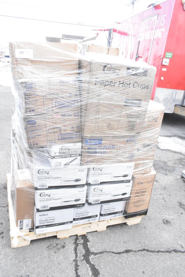 Plastic-wrapped pallet of new "Scratch and Dent" items including paper hot cups, multi-fold towels, taster spoons, and vinyl gloves.