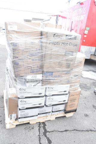 Plastic-wrapped pallet of new "Scratch and Dent" items including paper hot cups, multi-fold towels, taster spoons, and vinyl gloves.