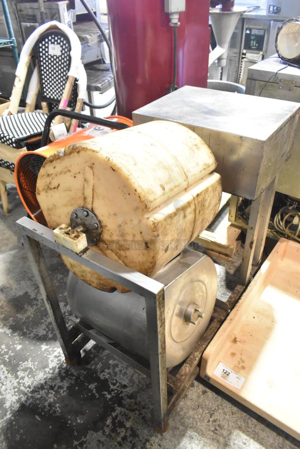 Commercial floor-style unit, industrial-grade, with visible wear and rust on metal frame. Barrel design, no visible labels.