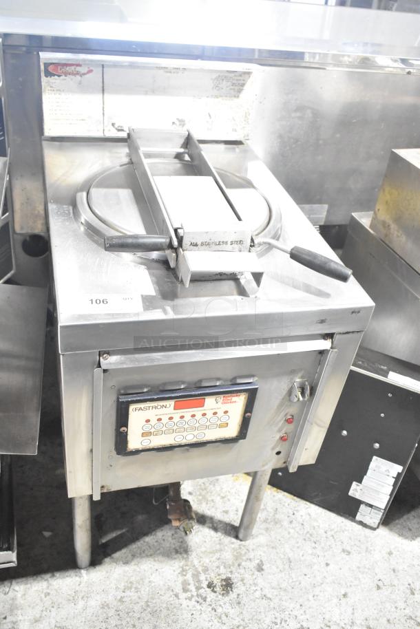 Commercial floor style pressure fryer in stainless steel. Features digital controls, visible wear. Model Fastron, by Collectramatic.