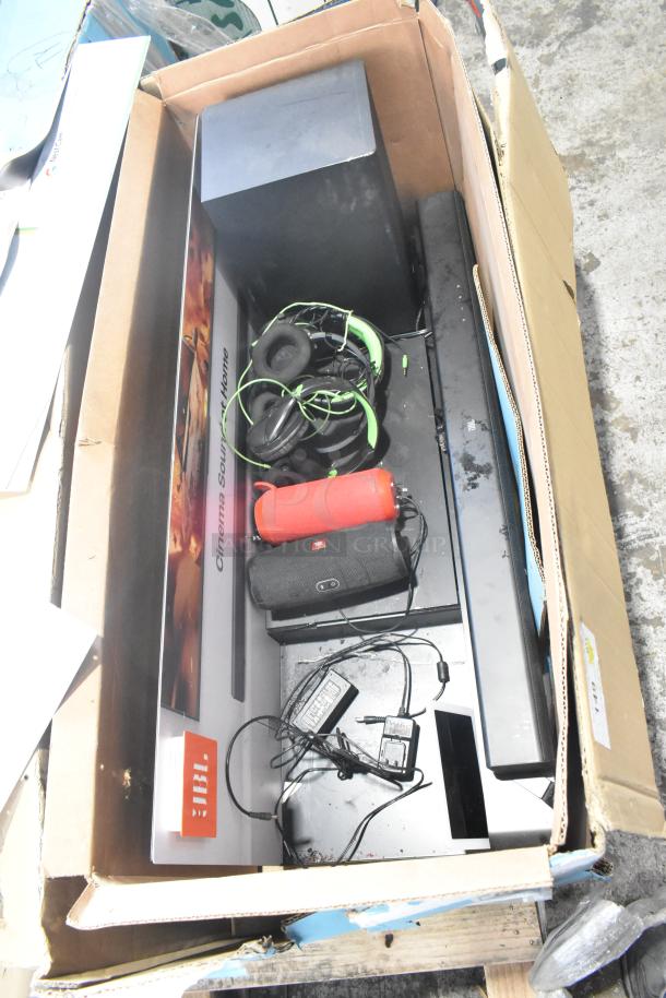 Boxed B Series soundbar and speaker set, includes black and red JBL speakers, tangled green headphones, cables. Condition: Used.