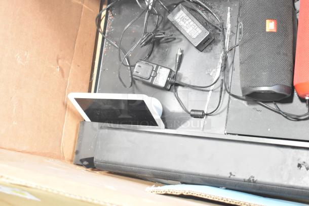 Black JBL speaker and B series soundbar with power adapters in good condition, boxed packaging.