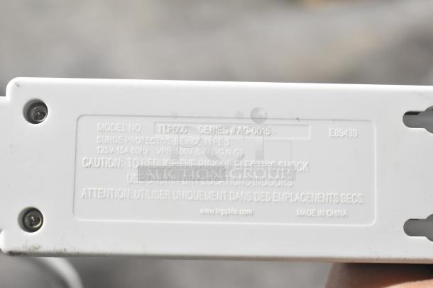 Power strip with label showing Model TLP606, Series AG-0015, 125V-15A, surge protection. Condition: used. Made in China.