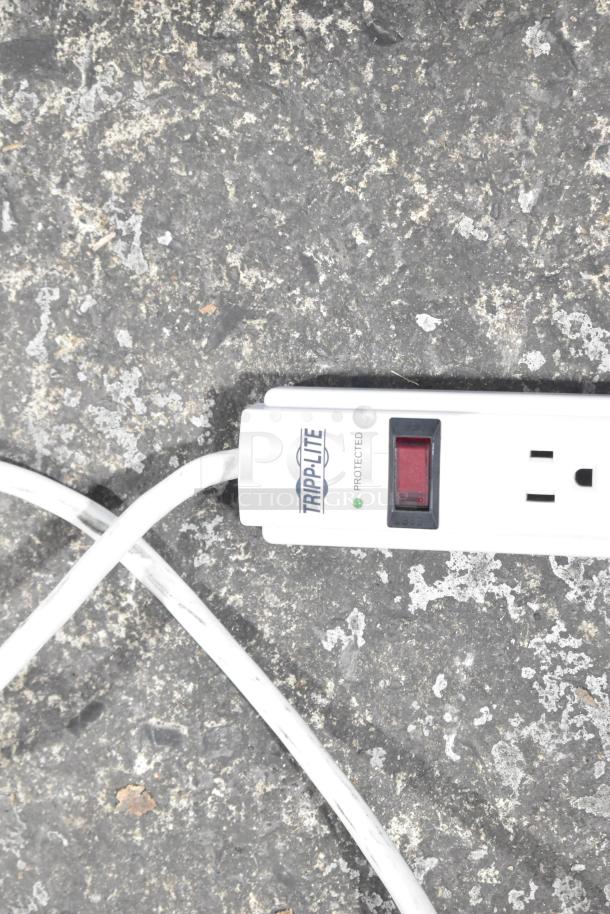 Tripp Lite power strip with surge protection, on/off switch, two outlets, white cord, slightly used condition.