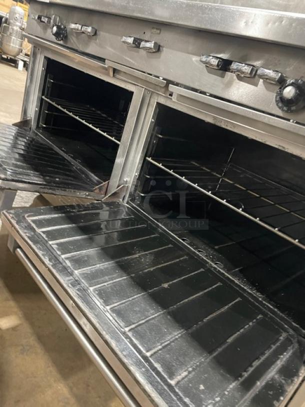 Garland H284 stainless steel 10-burner range with double oven, backsplash, wired oven rack, on casters, natural gas.