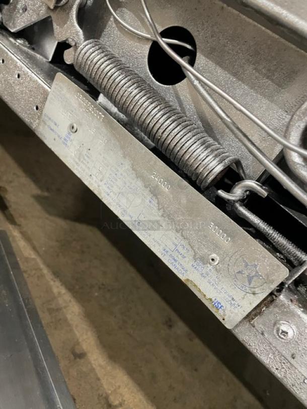 Garland Model H284 stainless steel label on commercial gas range, detailing specifications and measurements.