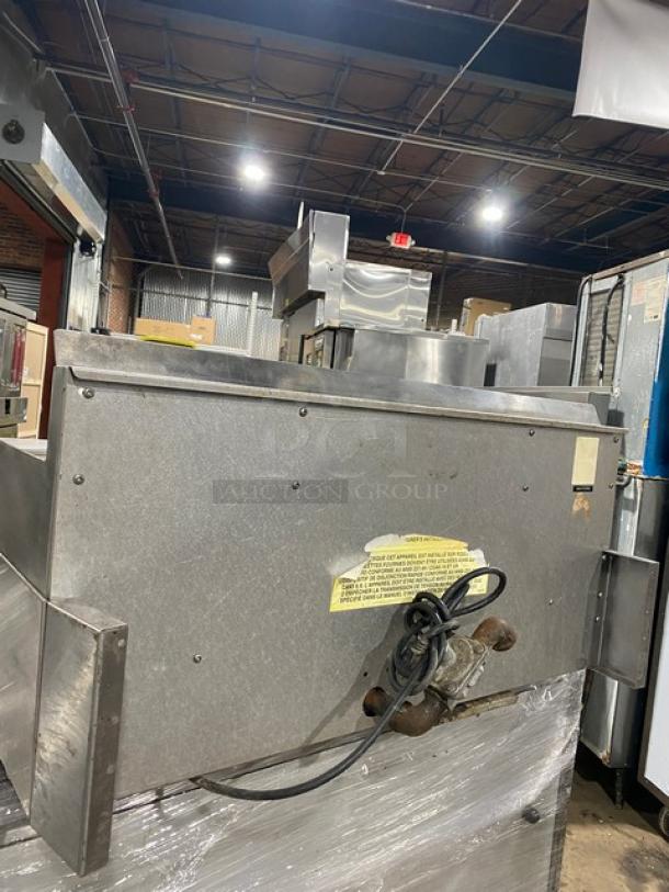 Garland stainless steel gas countertop griddle with back and side splash, thermostatic control, visible power cord, used condition.