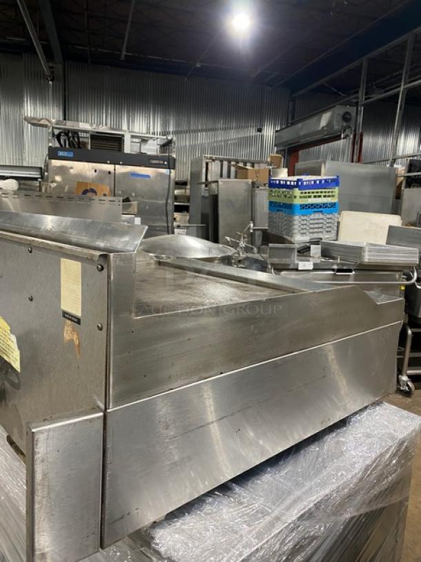 Garland commercial stainless steel gas countertop flat griddle with back and side splash, thermostatic control, good condition.