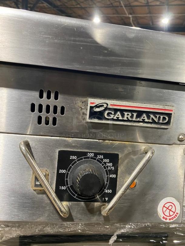 Garland stainless steel gas countertop flat griddle with thermostatic control, back & side splash, used condition.