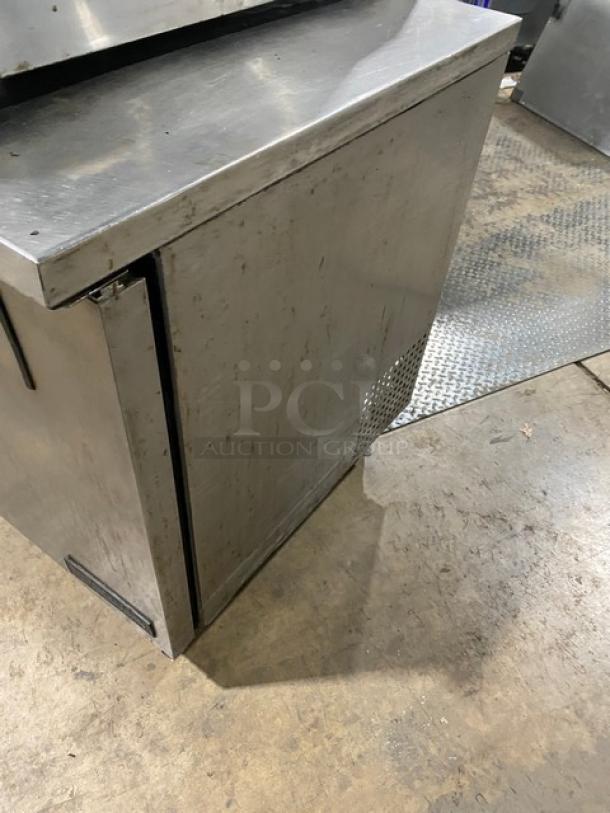 True TUC-48 stainless steel 2-door worktop refrigerator, poly coated rack, on casters, serial 5113050, 115V, 1 phase.