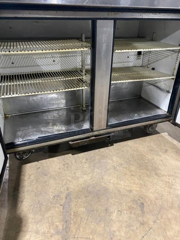 True TUC-48 commercial stainless steel 2-door worktop refrigerator with poly-coated wire racks, on casters, 115V, SN: 5113050.