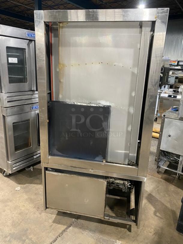 Commercial stainless steel gas-powered 3-compartment seafood steamer with individual controls, wired oven rack, on legs.