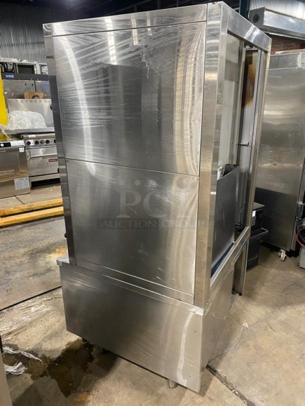 Commercial stainless steel 3-compartment seafood steamer with individual controls, wired oven rack, on legs. Gas powered.