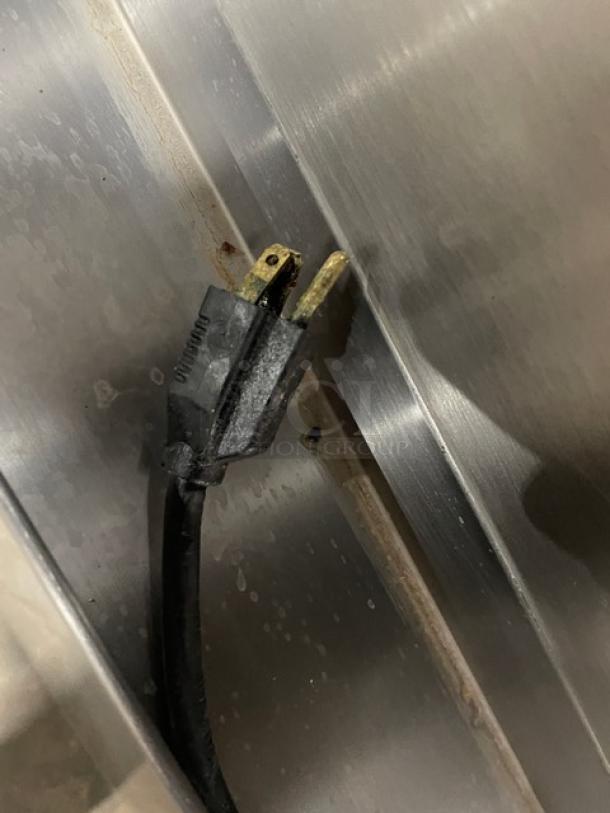 Cleveland Range commercial convection steamer power plug, Model 24CGA62S, stainless steel, showing wear.