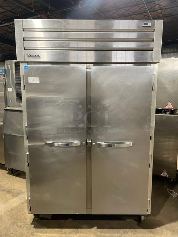 True STG2R Commercial 2-Door Reach-In Refrigerator, Energy Star certified, stainless steel, on casters, with poly coated wired racks. Serial: 8689302.